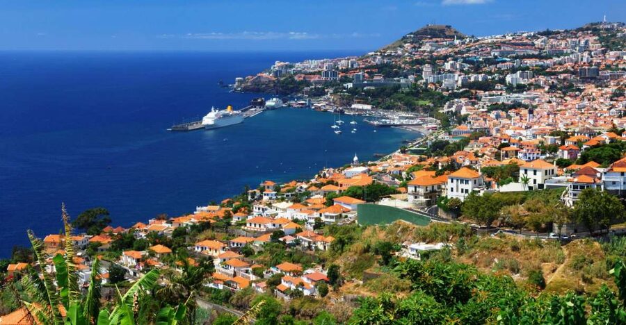 Funchal harbour and the town rising towards Monte
