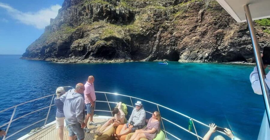 Madeira: Boat Trip with Lunch, Drinks, and Hotel Transfer - On deck: seating, sea views, and the dolphin start