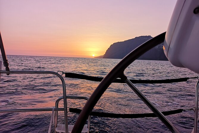 Madeira Private Sunset Boat Tour from Funchal - Onboard comfort: wine, snacks, restroom, and music